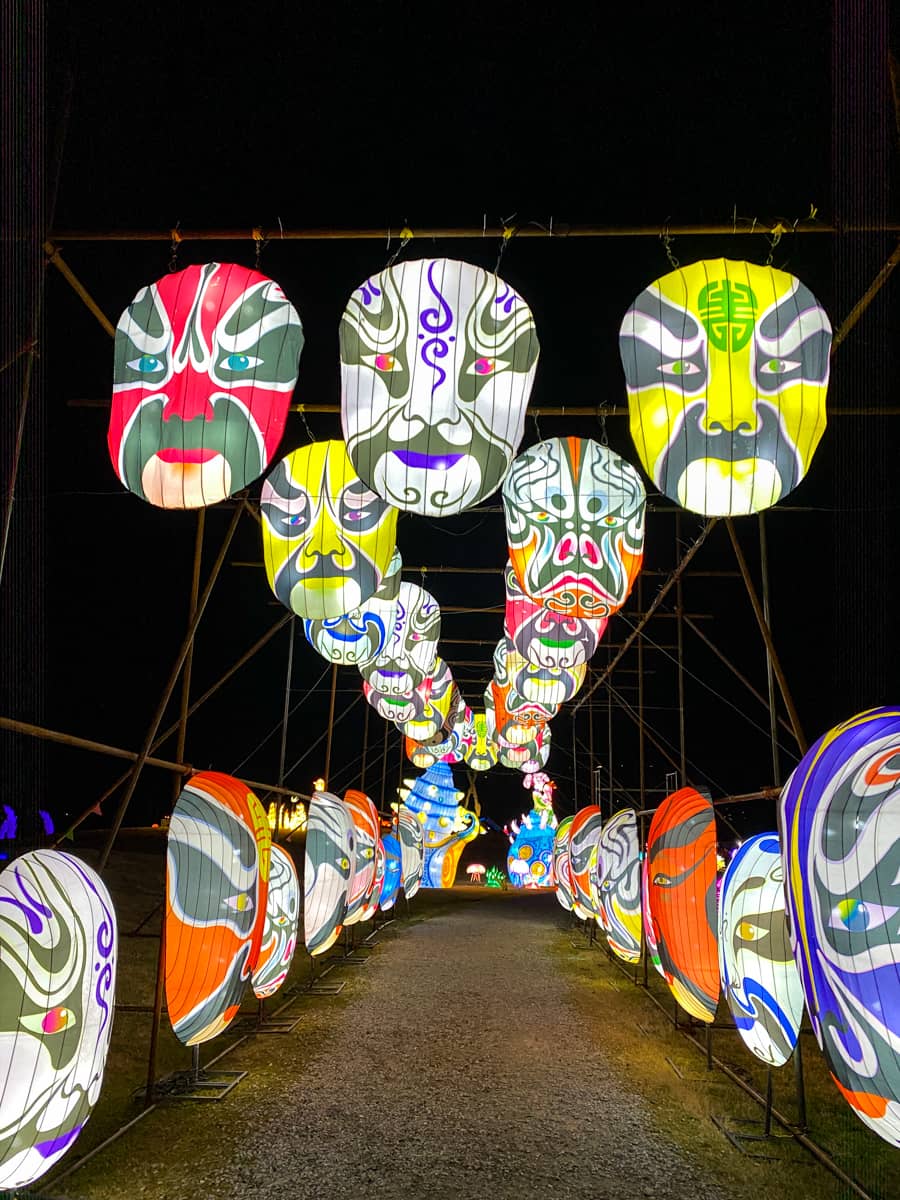 A large multi-colored masked lantern display at the Sealight Festival